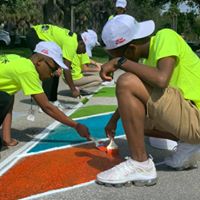 students painting mural